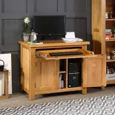 Computer armoires are becoming popular because you can close the doors and hide away unsightly hardware. Cheshire Oak Hideaway Home Office Computer Desk The Furniture Market