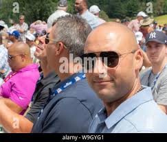 Former New York Yankees' Tino Martinez walks