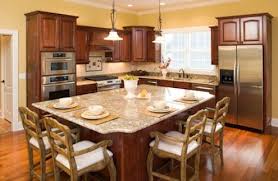 7 things to know before putting wood flooring in the kitchen. Bob Vila Radio Kitchen Islands Kitchen Island Design Granite Kitchen Island Kitchen Layout