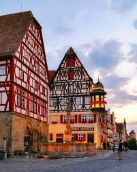 This Beautiful Half Timbered Building In Front Of St George Fountain Has Been Housing A Pharmacy Since 1812 The Marien Apot House Building House Styles