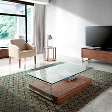 Ledell 51 coffee table, clear glass with walnut base by euro style $768 $1,102 ledell 51 coffee table in clear glass with walnut base distinct and visually mesmerizing, the ledell coffee table is the perfect addition to any home with a modern or contemporary feel. Contemporary Coffee Table 2004 Angel Cerda Tempered Glass Crystal Curved Glass
