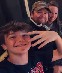 Can someone clean up this photo, maybe have my son's hand down? Thanks in  advance