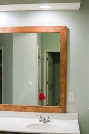 How To Diy Upgrade Your Bathroom Mirror With A Stained Wood Frame Building Our Rez Bathroom Mirrors Diy Bathroom Mirror Frame Bathroom Mirror