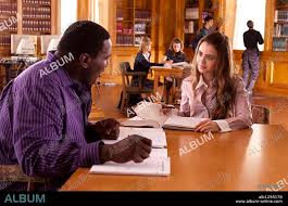 LILY COLLINS and QUINTON AARON in THE BLIND SIDE, 2009, directed by JOHN  LEE HANCOCK. Copyright ALCON ENTERTAIMENT
