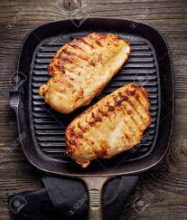 How do you cook on a grill pan? Grilled Chicken Fillet On Cooking Pan Stock Photo Picture And Royalty Free Image Image 45560186