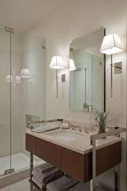 In a large bathroom, it's important to include multiple light sources to create layers of light. Http Www Indebleu Net Wp Content Uploads 2012 10 Modern Bathroom Lighting Ideas With Wall Sconces I Modern Bathroom Lighting Modern Bathroom Bathroom Sconces