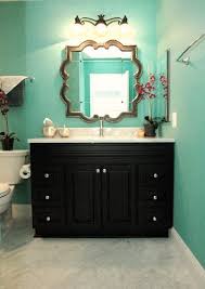 How Cute Is This Bathroom We Love The Aqua Colored Walls With The Neutral Tones And How Just The Cabinet I Eclectic Bathroom Turquoise Bathroom Teal Bathroom