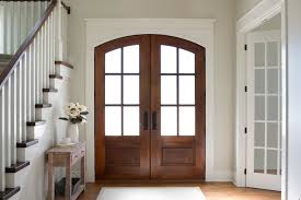 Fitted onto a slider and a door slides behind the other (a bypass) to create an opening. Wood Double Door Provides Warm Contrast To White Entryway Pella