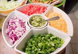 Taco bar includes two tacos (hard, soft shell, or both), seasoned ground beef or chicken, cheese, lettuce, sour cream, salsa, tomato, onion, jalapeños, tortilla chips, refried or black beans, spanish rice and cherry cheesecake or assorted cookies. How To Throw A Killer Taco Bar Party Easy Party Idea A Reinvented Mom