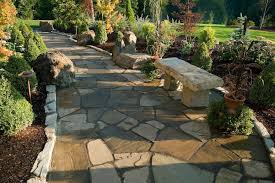 A natural stone patio like this one works like a big puzzle; 2021 Flagstone Prices Flagstone Walkway Costs Advantages
