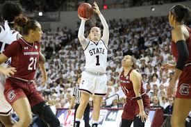South carolina players pose with their trophy as they celebrate their win over texas in a college basketball game in the elite eight round of the the no. No 2 Mississippi State Vs No 8 South Carolina Women S Basketball Preview For Whom The Cowbell Tolls