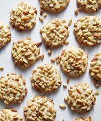 Line baking sheets with parchment; Pine Nut Cookies Pignoli There S No Prettier Cookie To Serve At Tea Time Then These Pignoli Studded Bites The Ad Recipes Italian Christmas Cookies Pignoli