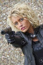 Female Assassin With A Silencer Handgun Menacing Someone Stock Photo,  Picture and Royalty Free Image. Image 15981534.