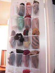 12 Insanely Creative Ways To Store Hats Gloves Scarves Sweaters Coats And More Winter Accessories Storage Winter Clothes Storage Scarf Storage