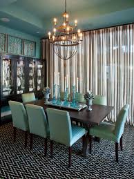 Pairing chocolate paneling and cabinetry with lacquered blue shelving and a reflective blue modern brown and white living room with navy pillows and a carpet. Eclectic Dining Room In Soft Turquoise And Brown Hgtv