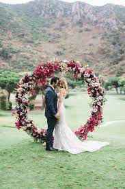 A Bold Fuchsia Blush And Hot Pink Floral Circle Wedding Arch With Leaves Wedding Archway Wedding Arch Wedding Ceremony Arch