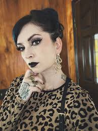 I need some help please This is the shirt/hair colour combo I'm wearing for  the trip of a lifetime in September. What colour jewellery should I use in  my piercings? Pics in