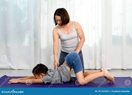 Mom teach yoga to her son stock photo. Image of mother - 181741292