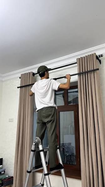 Specialist aligning bay window curtain track bracket