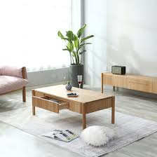 This coffee table is made from solid and engineered wood, and combines an antiqued white hue with a distressed brown tabletop for added charm. Japanese Style Simple Small Apartment Solid Wood Coffee Table With Drawer 0051 China Solid Oak Coffee Table Living Room Coffee Table Made In China Com