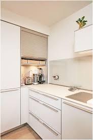 A Bulthaup B3 Roller Shutter Cabinet Creates A Space To Hide Away Those Everyda Bulthaup Cabinet Creates Luks Mutfaklar Ic Tasarim Ic Tasarim Mutfak