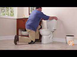 Need to move toilet at least 2 in more away from wall for tank to fit. How To Install A Toilet The Home Depot