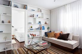 For an attractive living room layout, an equal amount of exposed flooring around your rug will balance the room and frame the rug. Ultra Small 30 Sqm Studio Apartment In Brazil Gets A Makeover In White