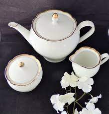 An Elegant Crisp White Bone China Teapot Cream Jug And Sugar Bowl All Edged With Gold Around A Scalloped Rim Made By Kahla C1970 Tea Pots Bone China Teapots China Teapot
