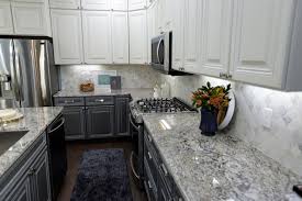 I've done gray cabinets in a kitchen before, i still love it, but for this remodel, i'm choosing a warmer neutral. Contemporary Kitchen With White Upper Cabinets And Gray Lower Cabinets Hgtv