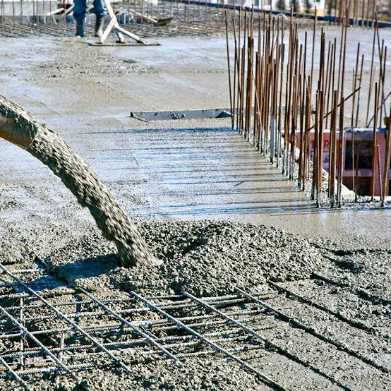 General contractor inspecting retaining wall foundation in San Jose