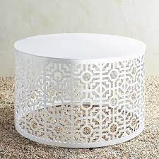 Round tables are easy to move around while square tables pair well with sectionals. Round Trellis White Metal Coffee Table