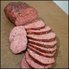 It was making summer sausage. Our All Beef Summer Sausage Recipe Mixed By Hand With Tons Of Cracked Black Pepper Garlic And A Few O Homemade Sausage Sausage Recipes Summer Sausage Recipes