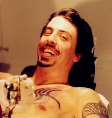 Dave grohl has multiple tattoos on his body, mainly on his arms chest and shoulders , including three led zeppelin inspired tattoo designs, one of which he tattooed himself. Out Of The Red When Did Dave Get All His Different Tattoos