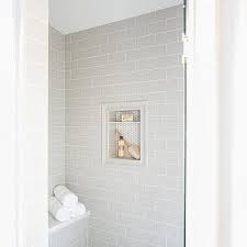Standard subway tiles are 3″x6″ (these appear to be about 3″x12″) so adjusting that ratio freshens the classic install a bit. Light Gray Brick Pattern Shower Wall Tiles Design Ideas