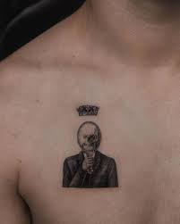 Grey ink death skull and life lily flower tattoo on sleeve. What Do You See When You Look At Your Reflection For
