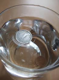 a japanese 1 yen coin can float