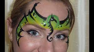 This is a quick easy dragon face painting that doesn't rely on any blending. Dragon Mask Face Painting Tutorial Youtube