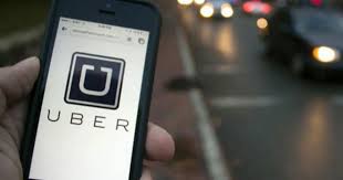 The uber app is seen on an iphone near a driver's vehicle after the company launched service, in vancouver, friday, jan. 5 Things You Should Do Before You Get Into An Uber Vehicle Cbs News