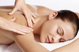 Hot masseuse relieves client's tension. Body Massage Treatments Lynton Beauty Salon