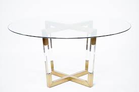 Praetorian dining table, glass/brushed gold base. Acrylic And Brass Dining Tables Mecox Gardens