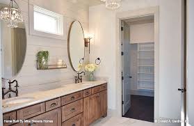 master bathroom with a double sink vanity and oval mirrors the blarney house plan 1424 built b new house bathroom beautiful bathrooms built in bathroom vanity