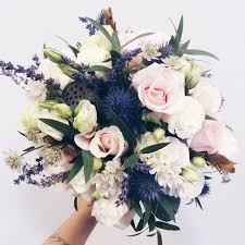 A funky wedding bouquet of a moss ball with blue blooms, billy balls and some blooms hanging down. Classic Wedding Colors Ideas Navy Blue And Blush Elegantweddinginvites Com Blog