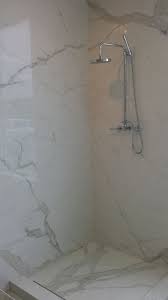 This Is A Grout Less Maintenance Free Shower System Using The Plane Product Callacatta Plane Bathroom Tile Designs Shower Remodel Marble Shower Walls