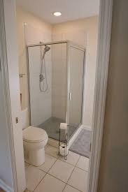 Custom fit wood framed corner bench for a diy shower. Diy Bathroom Makeover Angela Marie Made