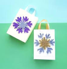 This video from youtuber hans masing demonstrates the process of creating a gift bag out of some wrapping paper. How To Make A Gift Bag Out Of Wrapping Paper Moms And Crafters
