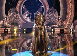 This season's costumes include baby alien, crocodile, broccoli, gremlin, mushroom, jellyfish, whatchamacalit, lips, squiggly monster, popcorn, sun, dragon, giraffe. Watch The Masked Singer Sun Get Emotional After Season 4 Finale Performance Sneak Peek