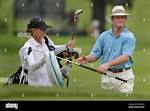 Tom Kite takes his putter from his caddie Sandra Jones as he walks ...