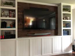 A storage column built flush with a wall bump. Custom Built In Entertainment Center Woodworking