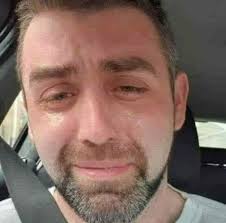 This is the final photograph of Phillip Herron 34, crying in his car,  literally minutes before taking his own life. He was a single Dad with  three kids, struggling with crushing debt