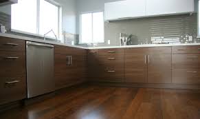 The beautiful kitchen backsplash is glass tile, island stone palms series in the spring color. Walnut Cabinet Doors Houzz
